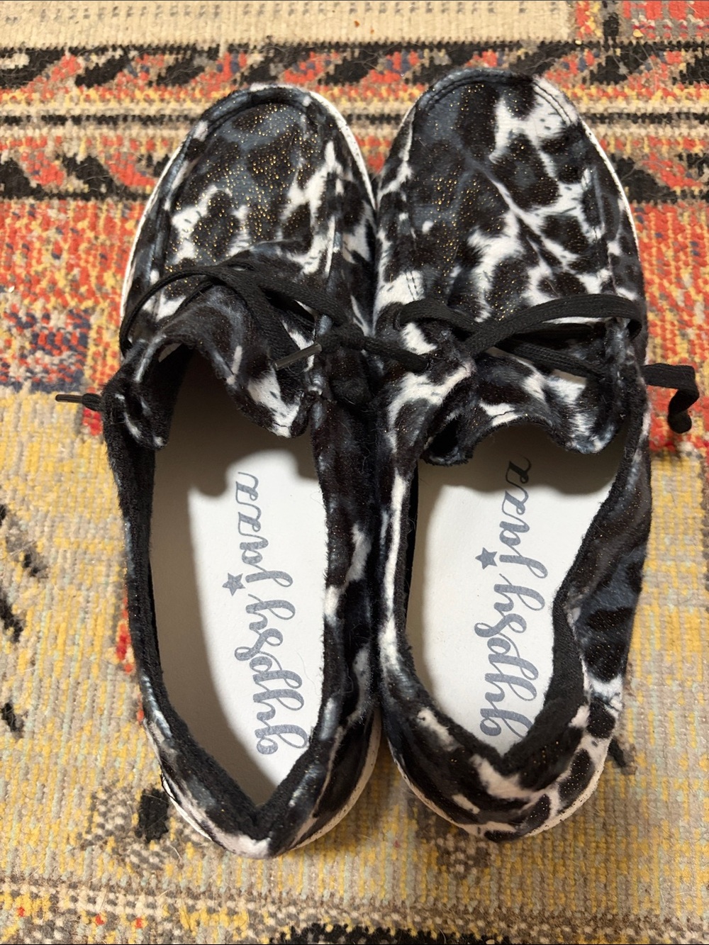 Gypsy Jazz Black & White Cow Print Slip-On Sneakers